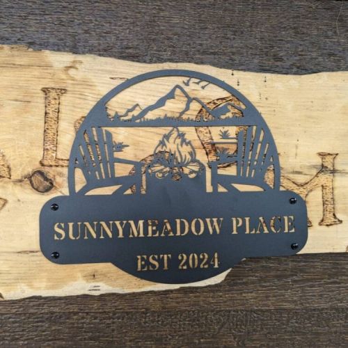 Custom wooden sign marking your stay at Sunny Meadow Place—handcrafted charm that sets the tone for a memorable visit.