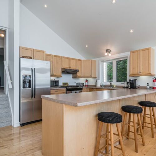 A fully stocked kitchen with eating island awaits you. It is the perfect place to entertain and share a meal.
