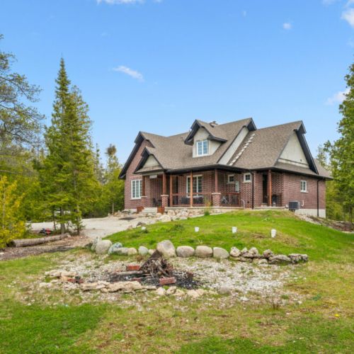 Nestled among the trees, Brick House offers privacy, open green space, and room to enjoy the outdoors.