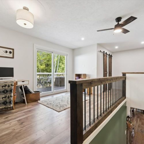 Bright multi-use room with sliding doors to the deck — great for games, reading, or relaxing.