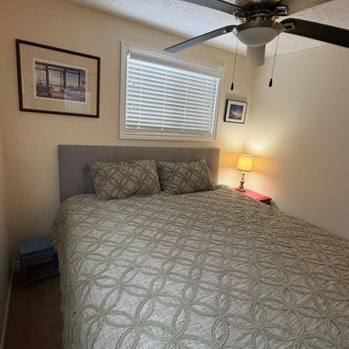 Another view of the bedroom showing the relaxing setup and warm lighting.