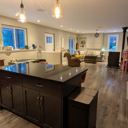 Large open living space connecting the kitchen, dining, and living areas — ideal for gathering with family and friends.