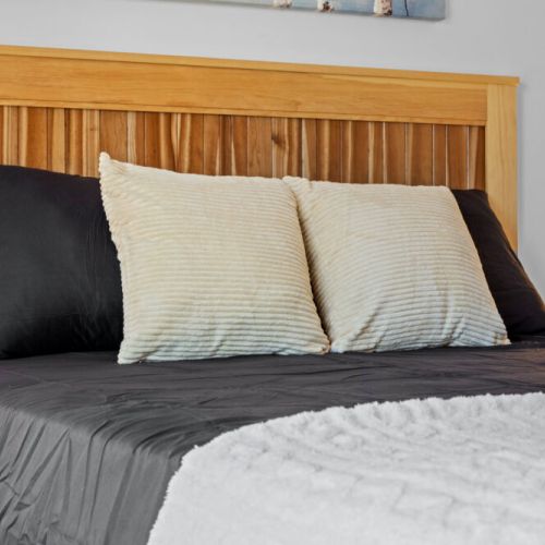 Soft linens and comfortable bedding help ensure a restful night's sleep.