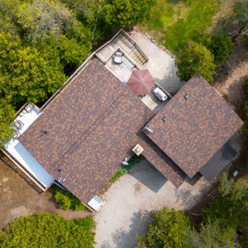A view of the home and patios from above.