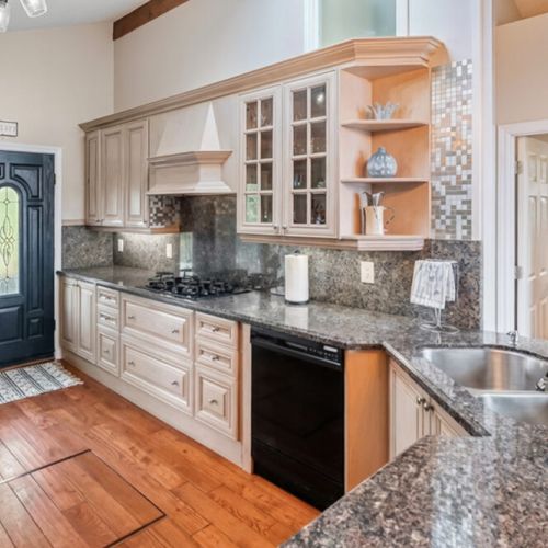 A spacious kitchen featuring gas cooktop, granite countertops, and quality cabinetry. Perfect for entertaining and elevated cottage travel.