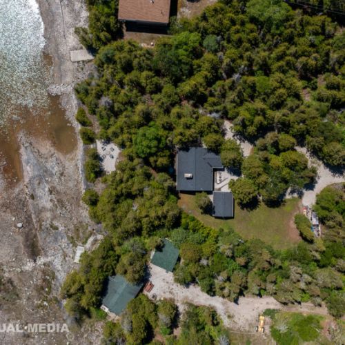 Bird’s-eye view showcasing the cottage’s private location just steps from the shoreline.