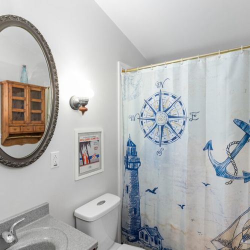 Full bathroom with tub/shower combination and everything you need for a comfortable stay.