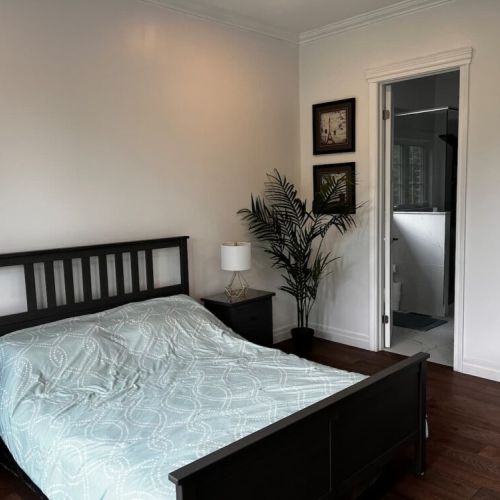 Comfortable bedroom with queen bed and easy access to a full bathroom