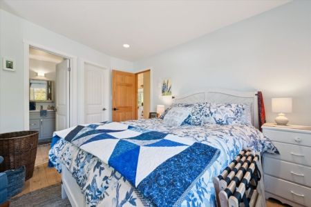 Drift off to sleep in this cozy bedroom, thoughtfully furnished to provide a relaxing retreat after a day of exploring.