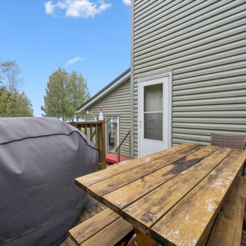 Outdoor deck with picnic table and BBQ—perfect for summer cookouts, morning coffee, or unwinding after a day of exploring.