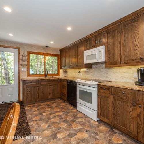 Spacious, fully stocked kitchen with everything you need for family meals during your stay.