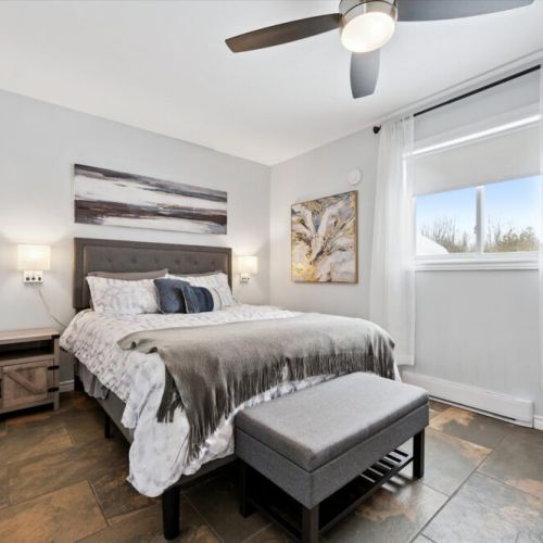 Spacious bedroom with soft lighting, updated finishes, and room to truly unwind.