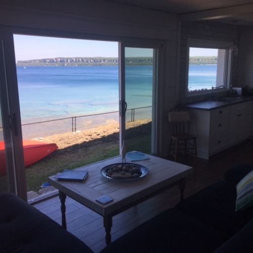 Floor-to-ceiling windows let the bay feel like part of the room.