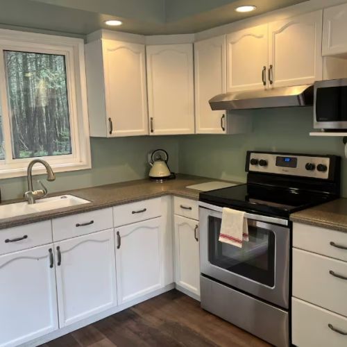 A fully equipped kitchen with stainless steel appliances and all the essentials to make cooking easy and enjoyable during your stay.