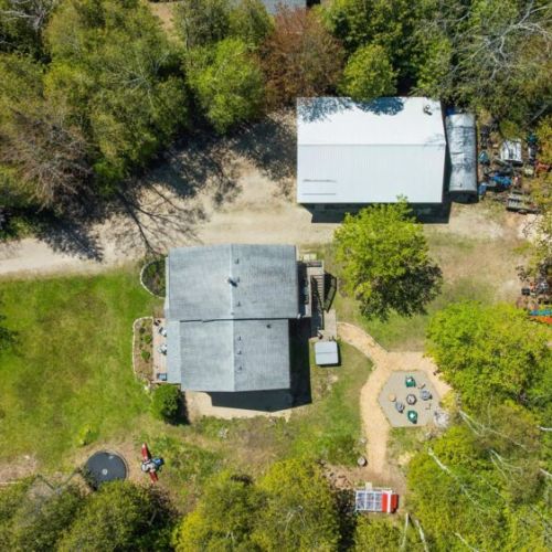 An aerial view of Larkwhistle shows the generous outdoor space, easy parking, and convenient layout for your group getaway.