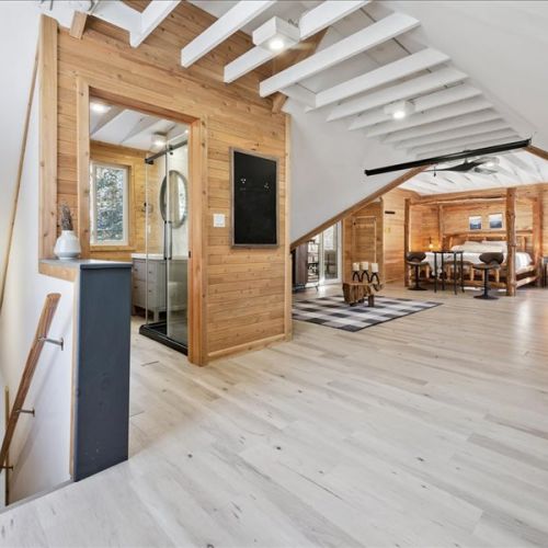 Bright interior with warm wood accents, vaulted ceilings, and open space to spread out. A comfortable layout for relaxing, working remotely, or spending time together.