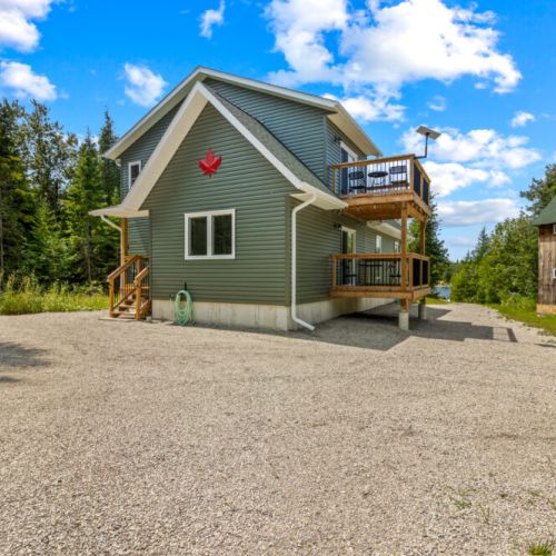 The cottage's charming exterior blends modern comfort with classic cottage style.