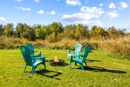 Gather around the outdoor firepit in Adirondack chairs for relaxing evenings under the stars.