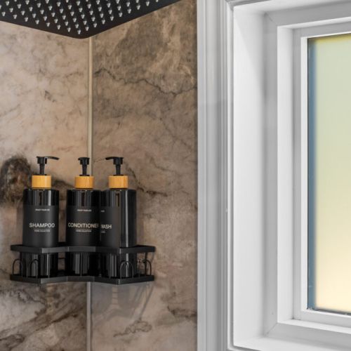 Premium shampoo, conditioner, and body wash are provided in every shower.