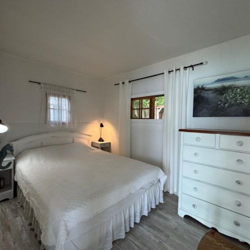Crisp white décor and soft lighting for restful nights.