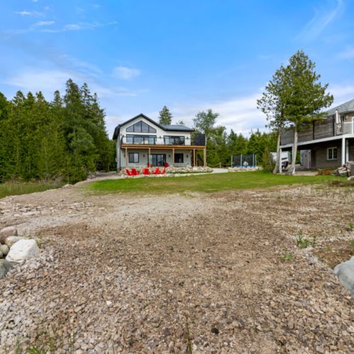 A long private driveway provides easy access and plenty of parking.