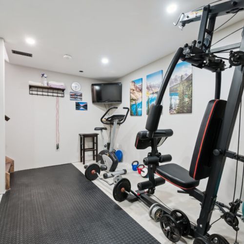 The lower level features a fully equipped exercise room for your fitness needs. For safety and comfort, access to the workout room is limited to guests 16 years of age and older.