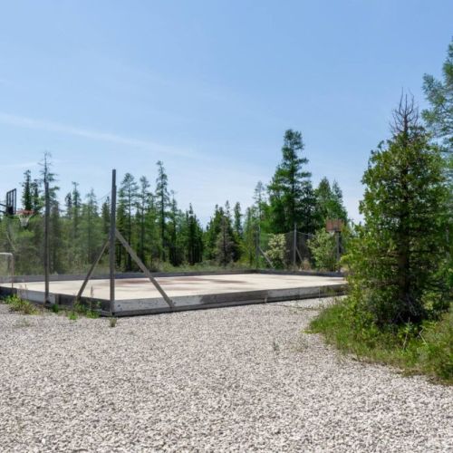 Your own secluded sports arena in nature! Enjoy basketball, street hockey, and more surrounded by peaceful forest trails.