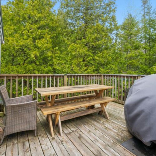 Wraparound deck with easy access to outdoor spaces—perfect for relaxing and entertaining.
