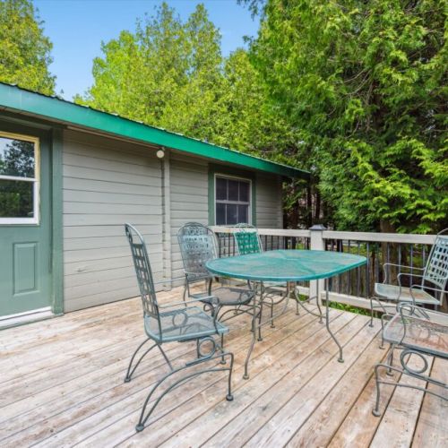 This charming outdoor dining space is ideal for slow breakfasts, sunset dinners, or sipping wine while listening to the rustle of the trees and chirping birds.