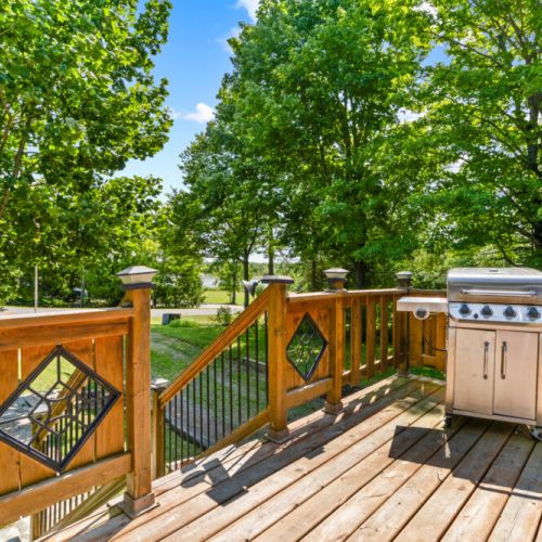 Fire up the BBQ and enjoy outdoor meals with glimpses of Miller Lake.