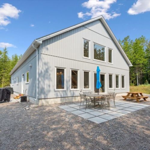 Dine under the open sky — this backyard patio offers ample space for alfresco meals, BBQ gatherings, and peaceful moments surrounded by nature.