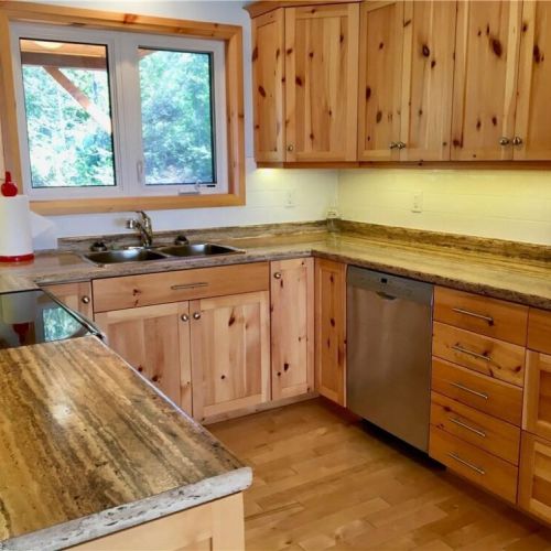 The bright kitchen workspace offers plenty of counter space and everything you need to cook comfortably during your stay.