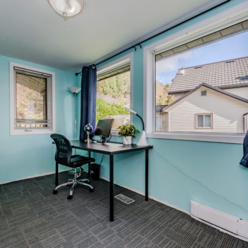 A dedicated workspace with natural light, perfect for those who may need to catch up on work or simply enjoy some quiet time during their stay.