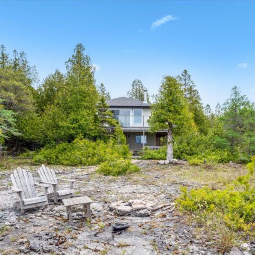 Tucked into a lush treeline, Stonehenge sits just off the shoreline — combining forest privacy with the natural beauty of Lake Huron’s rugged coast.