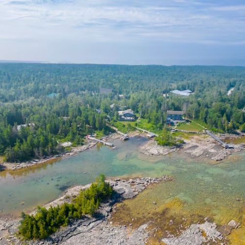 Another aerial look at the bay, showing the crystal-clear waters and tucked-away charm of this lakeside retreat.