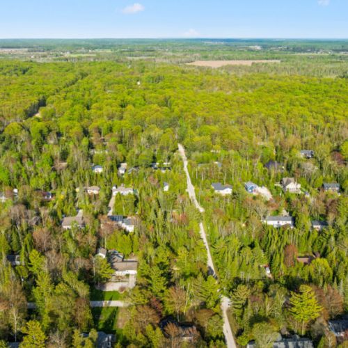 Surrounded by mature forest, the property offers privacy and a true cottage-country atmosphere.
