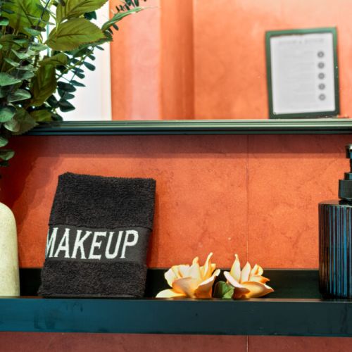 A charming vanity area adds character and convenience to this thoughtfully designed waterfront home.