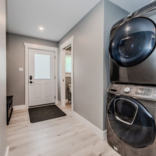 A dedicated laundry space with a modern washer and dryer, making it easy to keep clothes fresh during your stay.