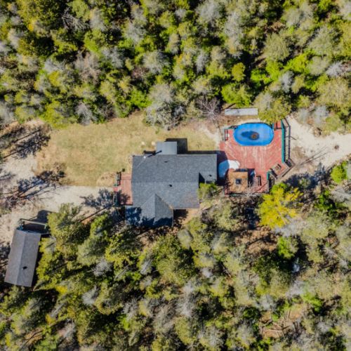 Private forested retreat with spacious decks and pool—ideal for family vacations, wellness escapes, or group rentals in cottage country.