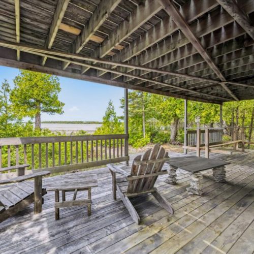 Relax under the shaded, spacious lower deck — perfect for afternoon lounging with serene water views and the sounds of nature all around.