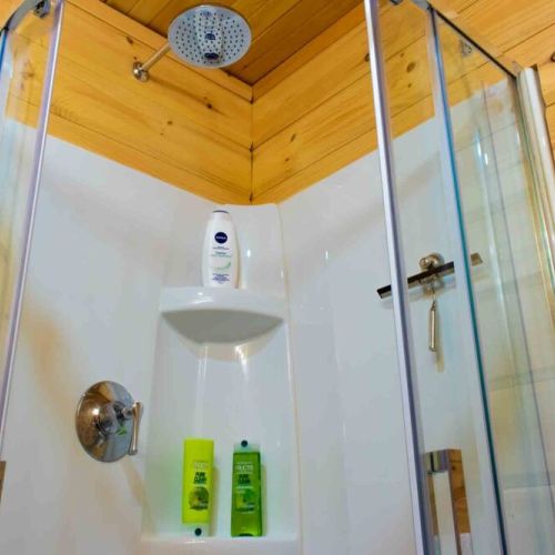 Refresh under the rainfall shower after a day of exploring.