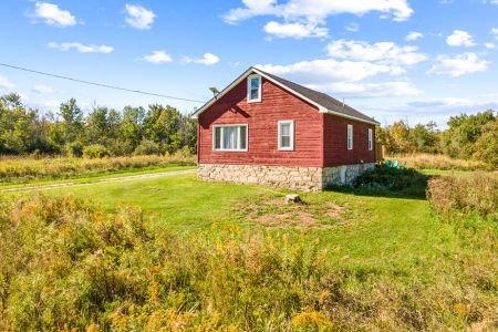 A peaceful country setting with wide-open lawn, surrounding greenery and plenty of privacy.