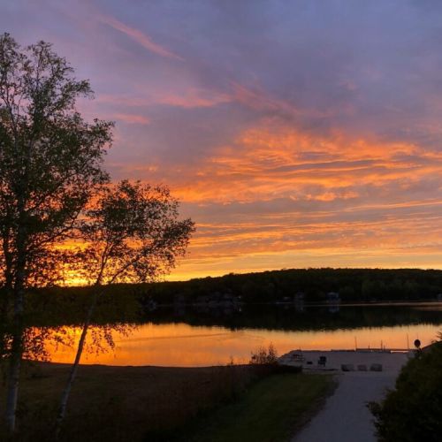 As the day ends, the sky over Little Lake paints a canvas of colors, promising another beautiful day at Jack's Retreat.
