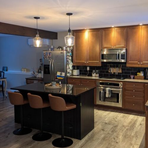 Large kitchen island with bar seating — perfect for casual meals, conversation, or entertaining.
