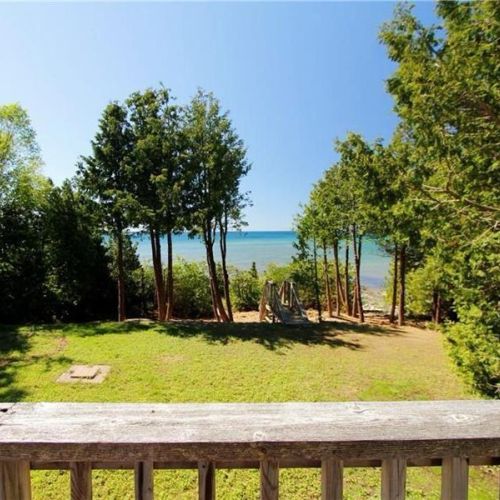 Wide, open yard with unobstructed views of the lake—ideal for relaxing and family time.