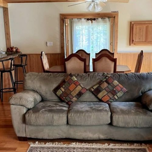 Open-concept living with dining and lounge space for group meals or board game nights—great for family vacations and retreats.