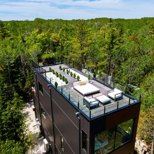 Perched high above the forest canopy, the rooftop terrace offers a private retreat for sunset cocktails, morning coffee, and unforgettable stargazing in Northern Bruce Peninsula’s Dark Sky community.