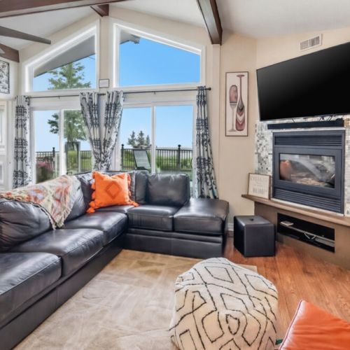 Spacious seating with large windows and scenic views. A comfortable retreat for families and groups enjoying a waterfront getaway.