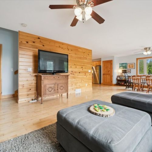 Inside, the bright living space offers modern comfort and an open layout for relaxing year-round.