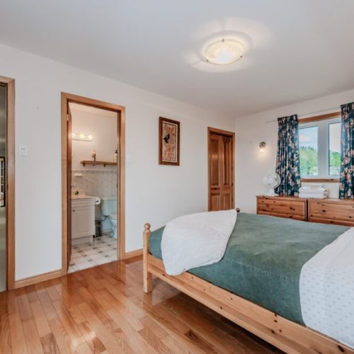 Comfortable and spacious bedroom with clean design and thoughtful touches. A restful space for couples or solo travelers.